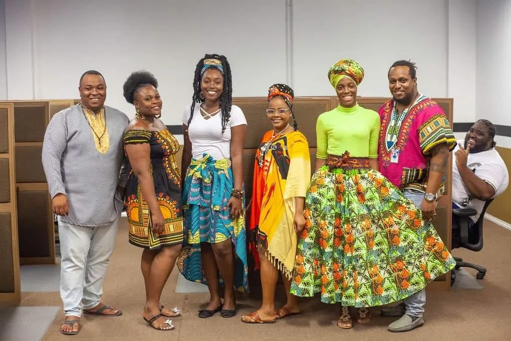 OnCalla team members in colorful outfits, together at the office